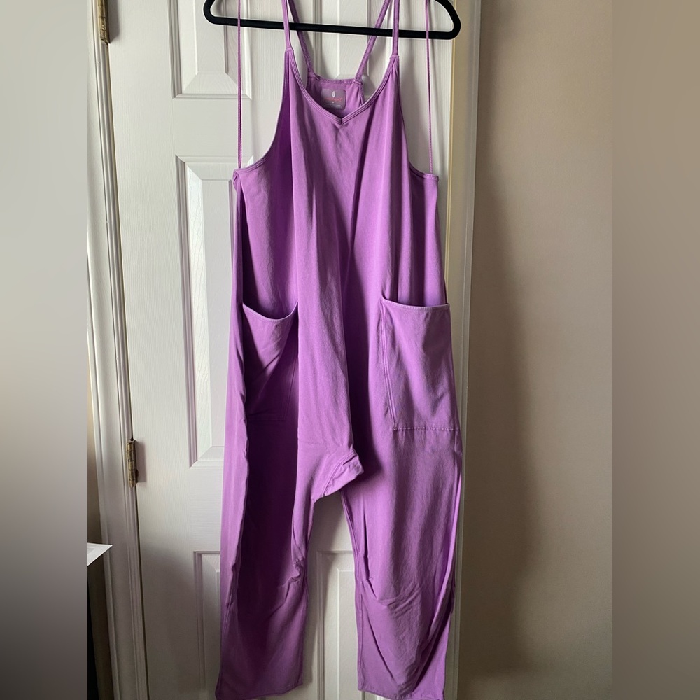 Size medium. Worn a few times. Has a small hole by right arm.